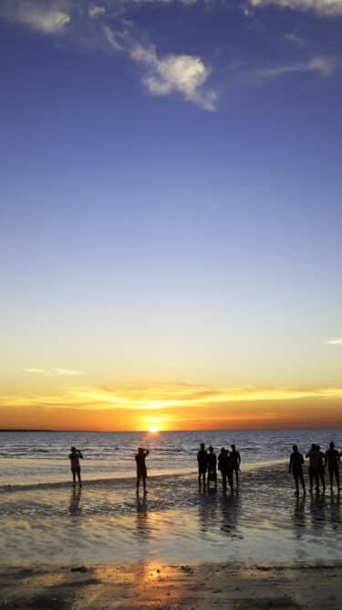 crowds come to watch the sunset at Mindil Beach Darwin