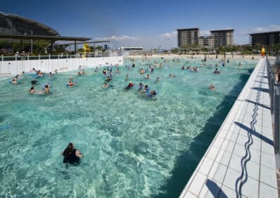 Darwin, Australia - June 25, 2009: Crowds of people swimming at the Darwin Wave Pool in central Darwin.  Darwin is the capital city of the Northern Territory.