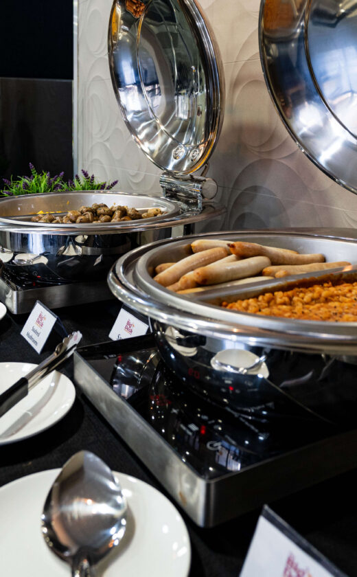 Enjoy a delicious breakfast buffet with eggs, sausages, and beans at our luxurious hotel restaurant, perfect for a relaxed stay.